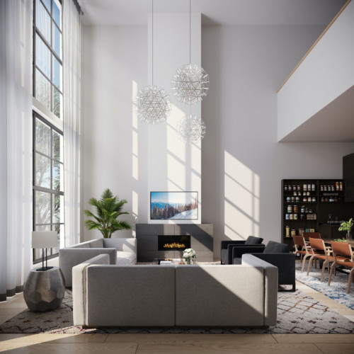 A living room with high ceilings, floor-to-ceiling windows, a modern fireplace, and grey seating.