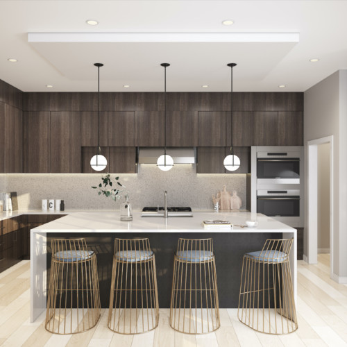 A spacious kitchen with dark walnut cabinets, a white waterfall island, and gold barstools.