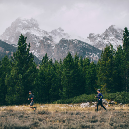 Two men trail run in Grand Teton National Park.