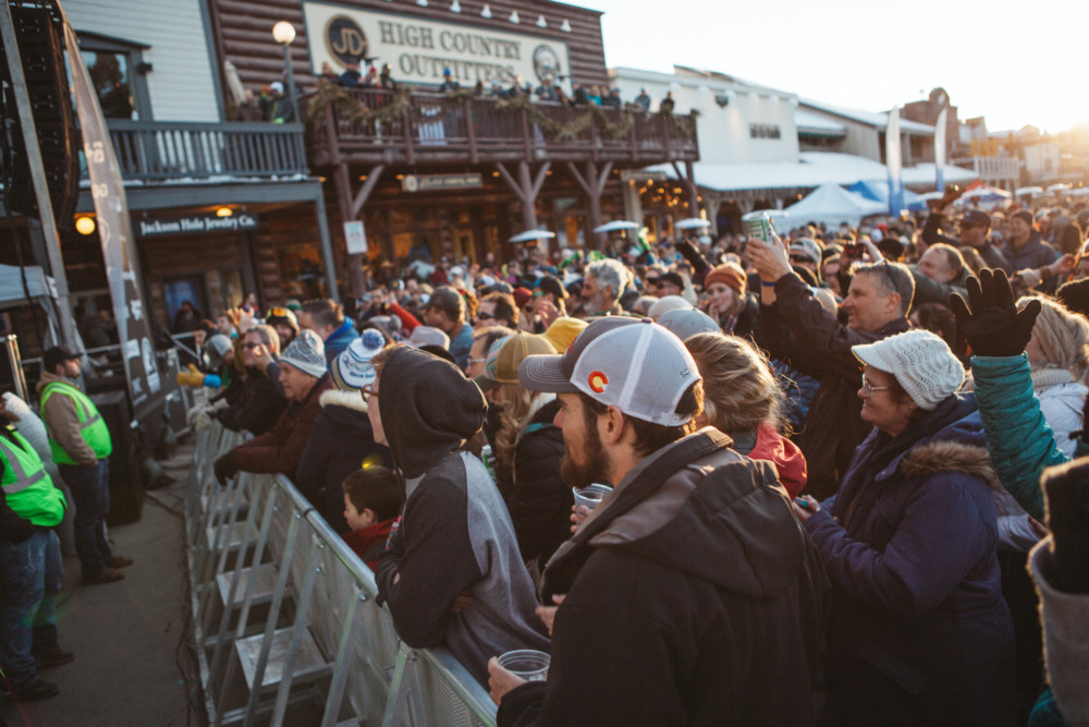 A crowd enjoying live music at the Rendezvous fest on the Jackson Hole town square.