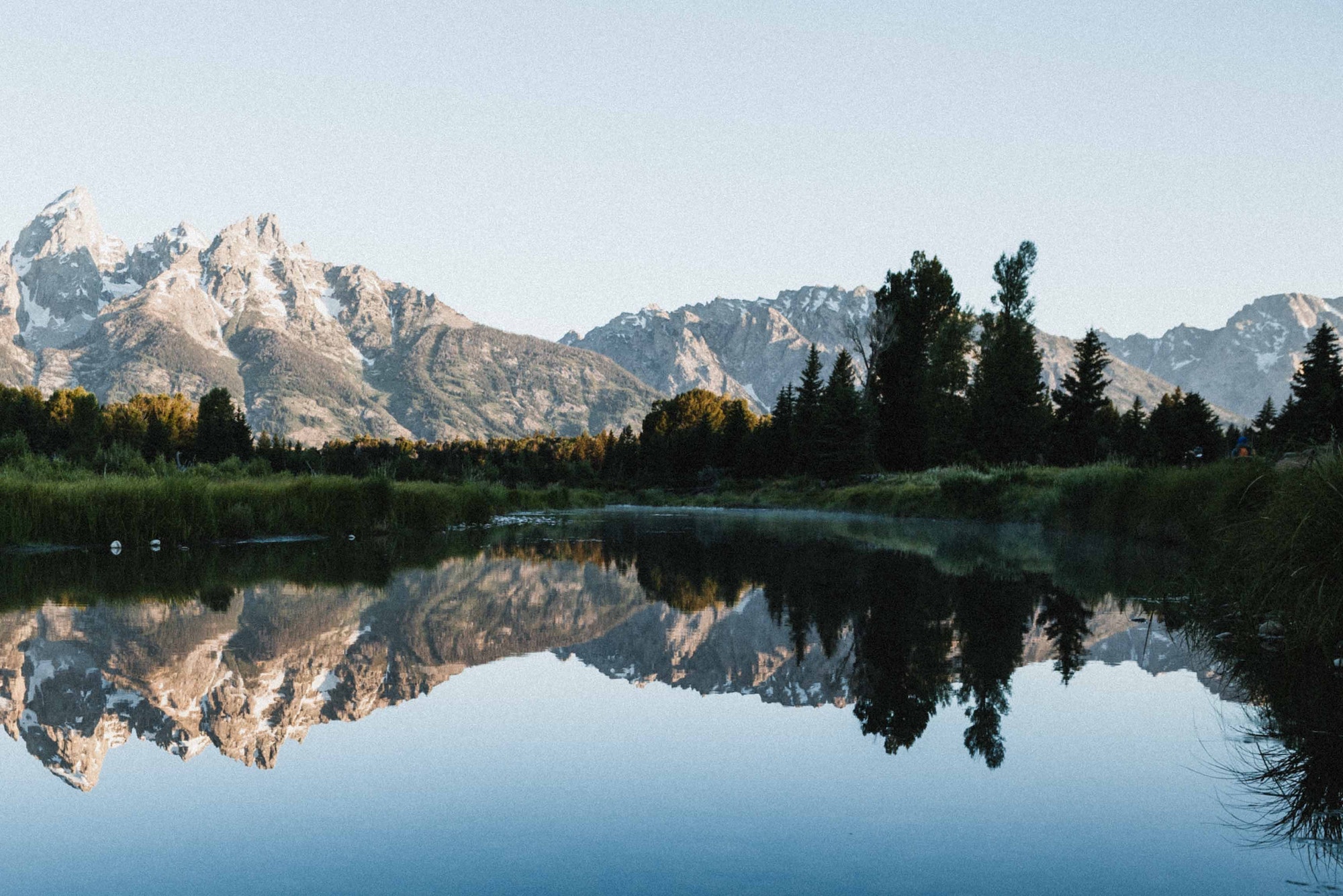 A perfect reflection of the Tetons at sunrise.
