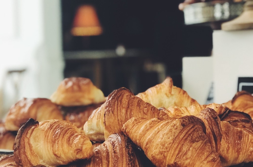 A pile of fresh croissants at Persephone Bakery.