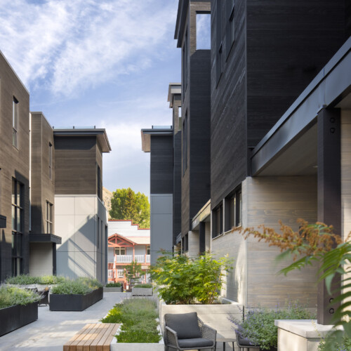 The exterior courtyard at The Glenwood condos with potted plants.